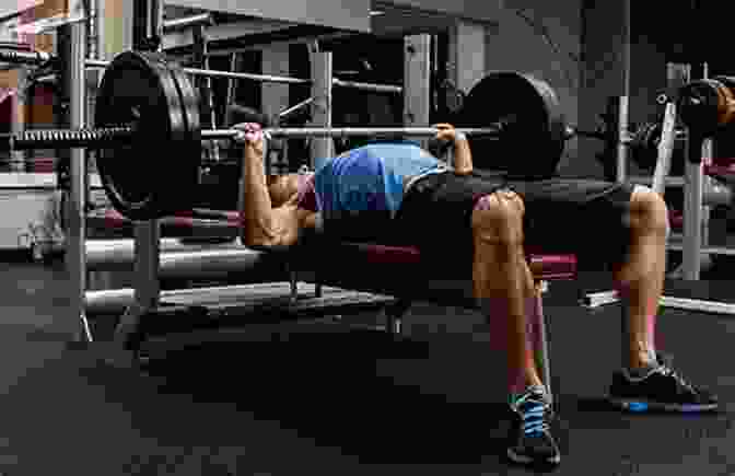 A Muscular Man Performing A Barbell Bench Press In A Gym, Showcasing The Revolutionary 20 RM Strength Training Program The Revolutionary 1 X 20 RM Strength Training Program